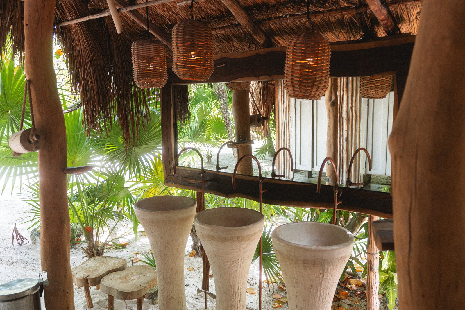 Outdoor sinks under a palapa roof