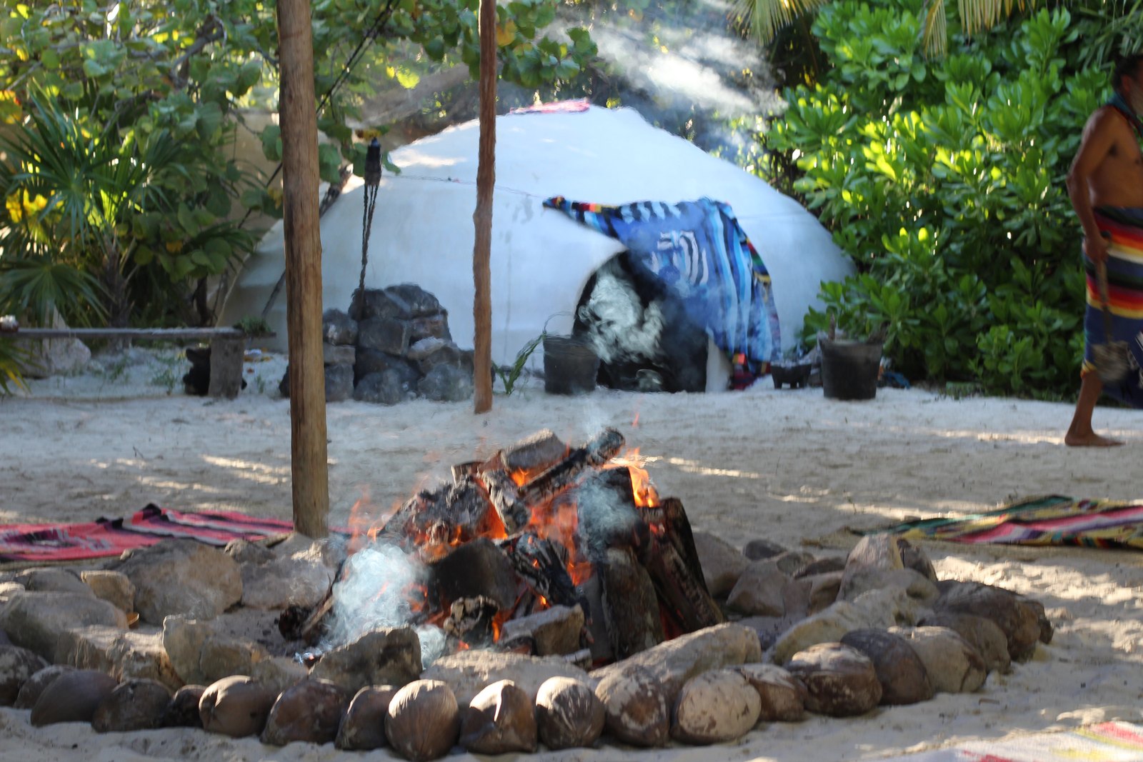 A fire circle on the sand