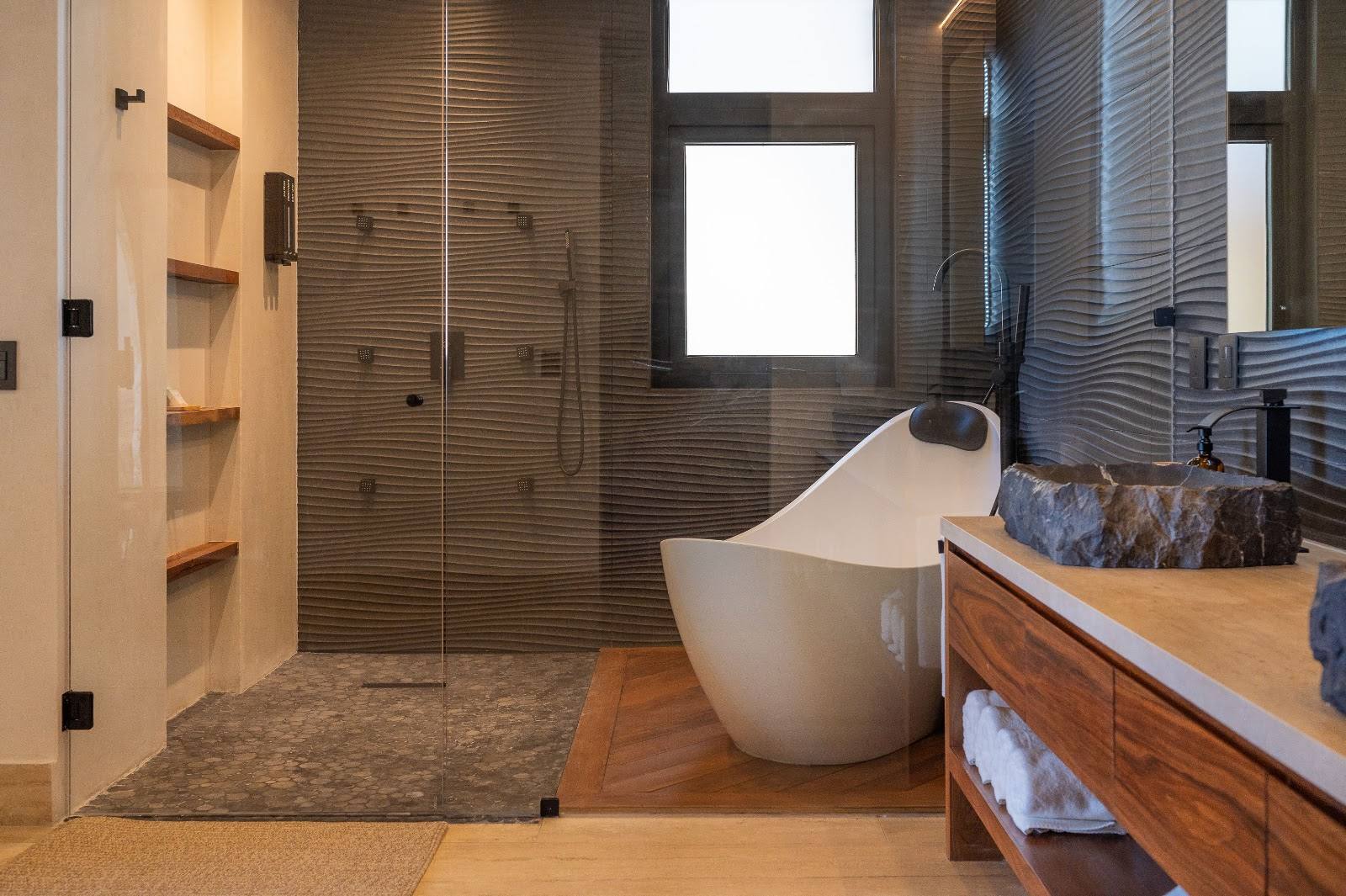 A bathroom with a freestanding tub and walk-in shower