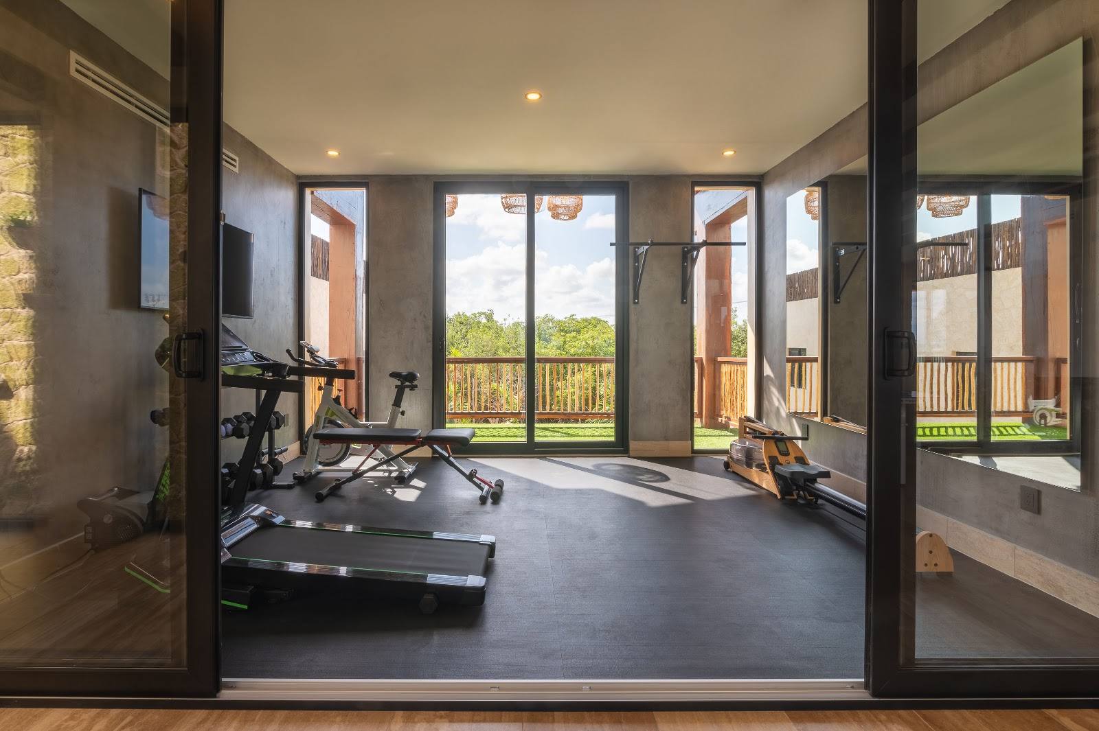 The gym with treadmill and weights