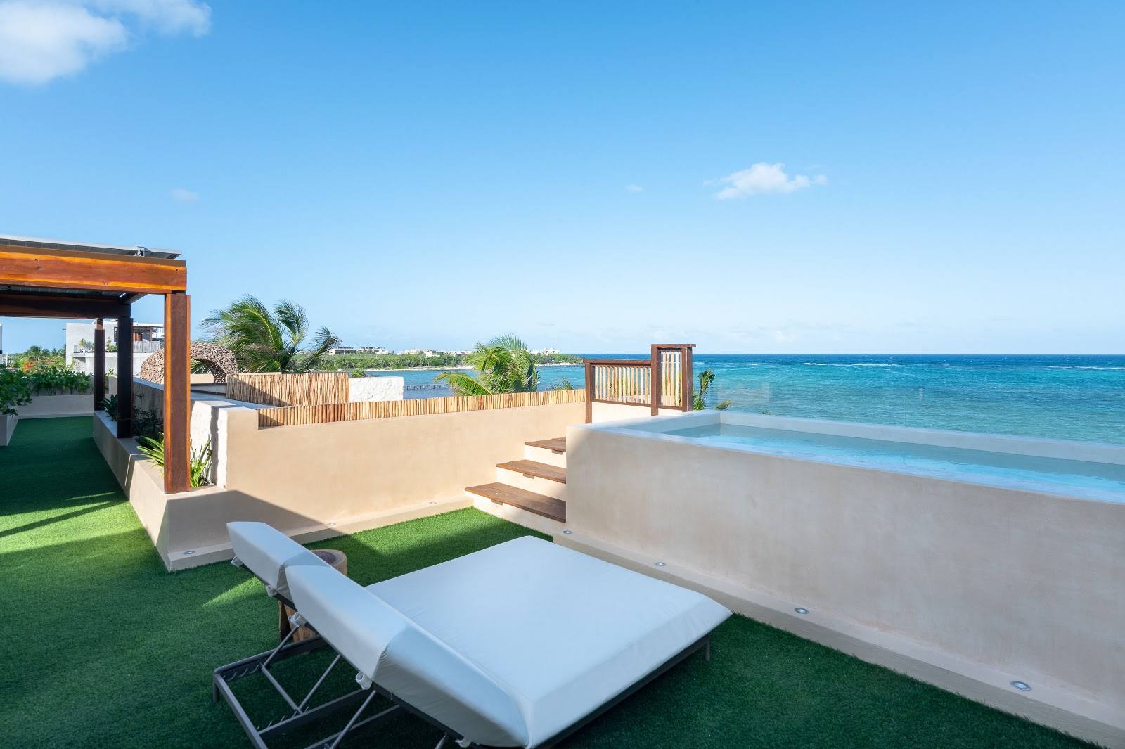 The rooftop plunge pool and lounger over the sea